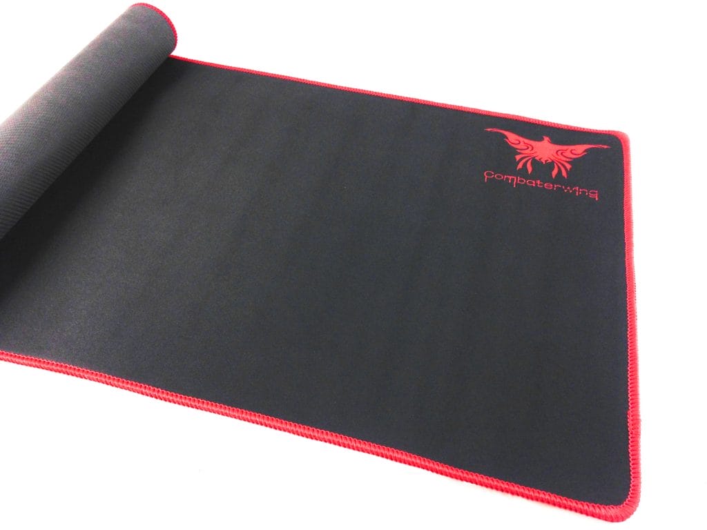 Image shows a black with red trim mouse mat partially rolled up.