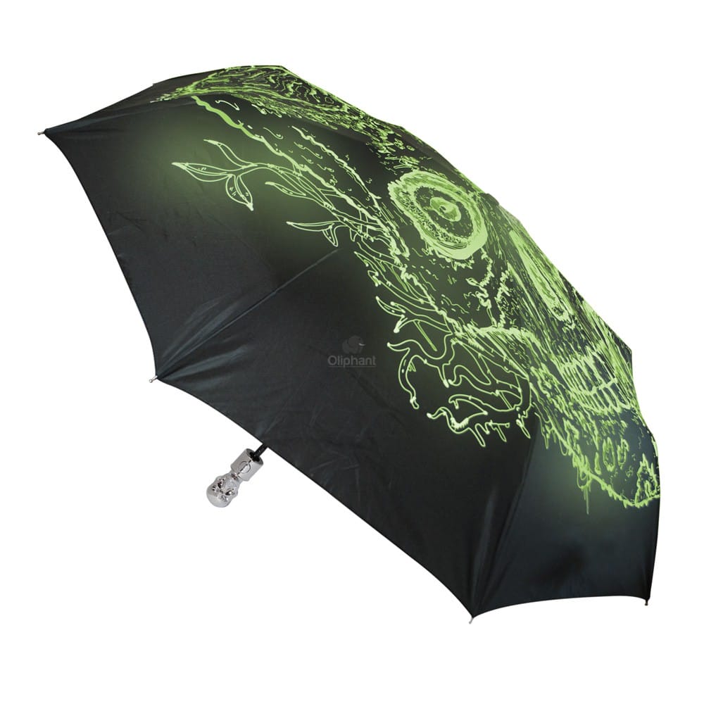Oliphant Skull Umbrella Image shows the design glowing in the dark, the umbrella is in an open position.