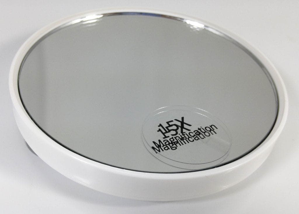 Image shows the smaller magnifying mirror.