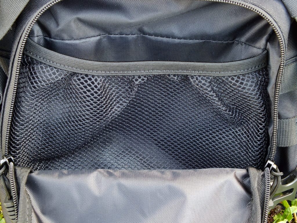 Inside the compartment behind the MOLLE panel of the BP20