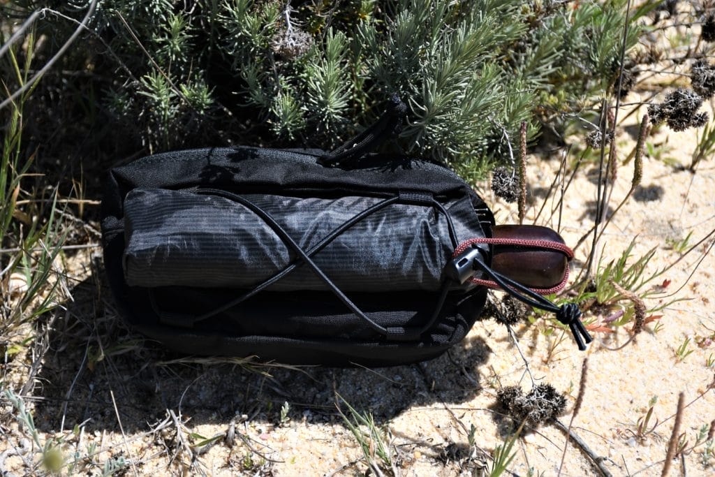 A loop of bungee cord allows you to carry items like this umbrella