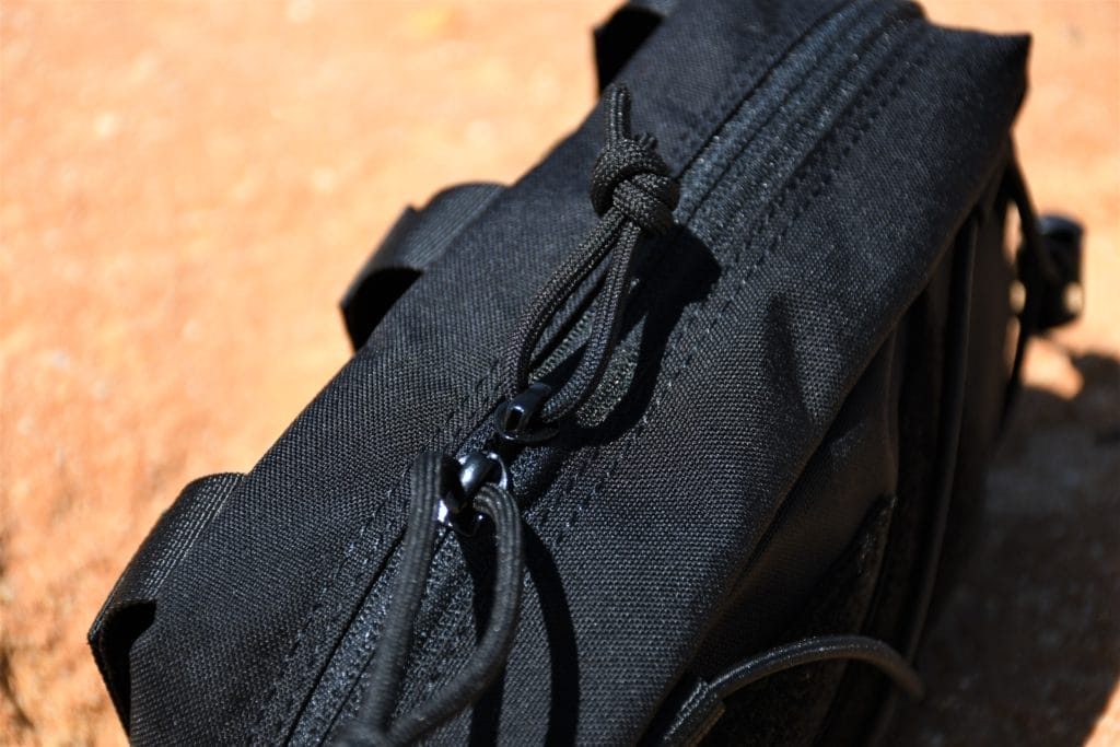 The zips have a loop of paracord that makes using them with gloves simple