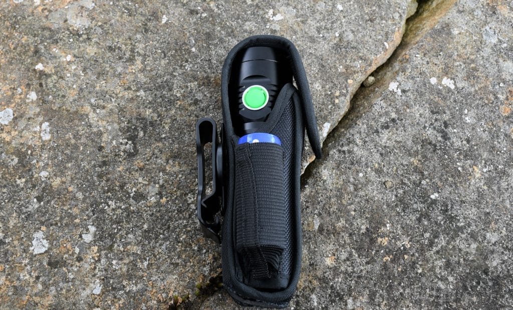 A photo of the WT01 Apollo and the 26650 battery inside the holster