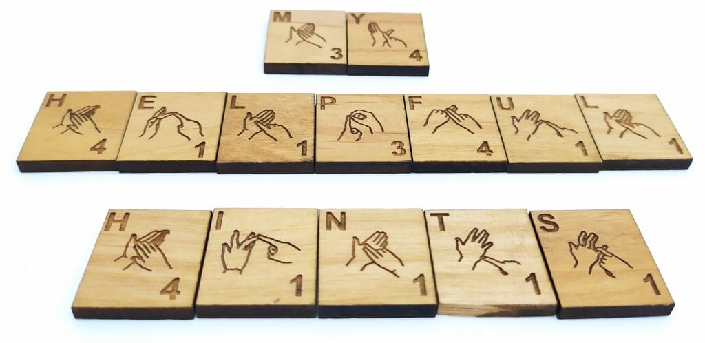 My Helpful Hints being spelled out using British Sign Language wooden scrabble tiles