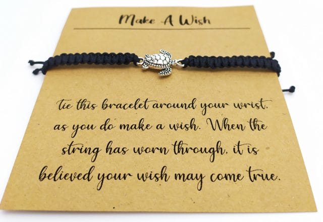 Image showing a Turtle bracelet wrapped around a Brown card.
