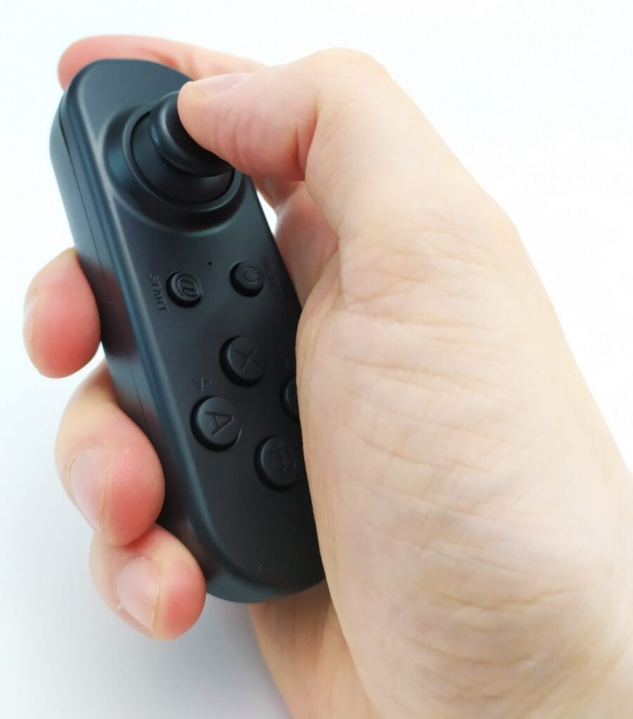 Image shows me holding and using the remote control in my right hand.