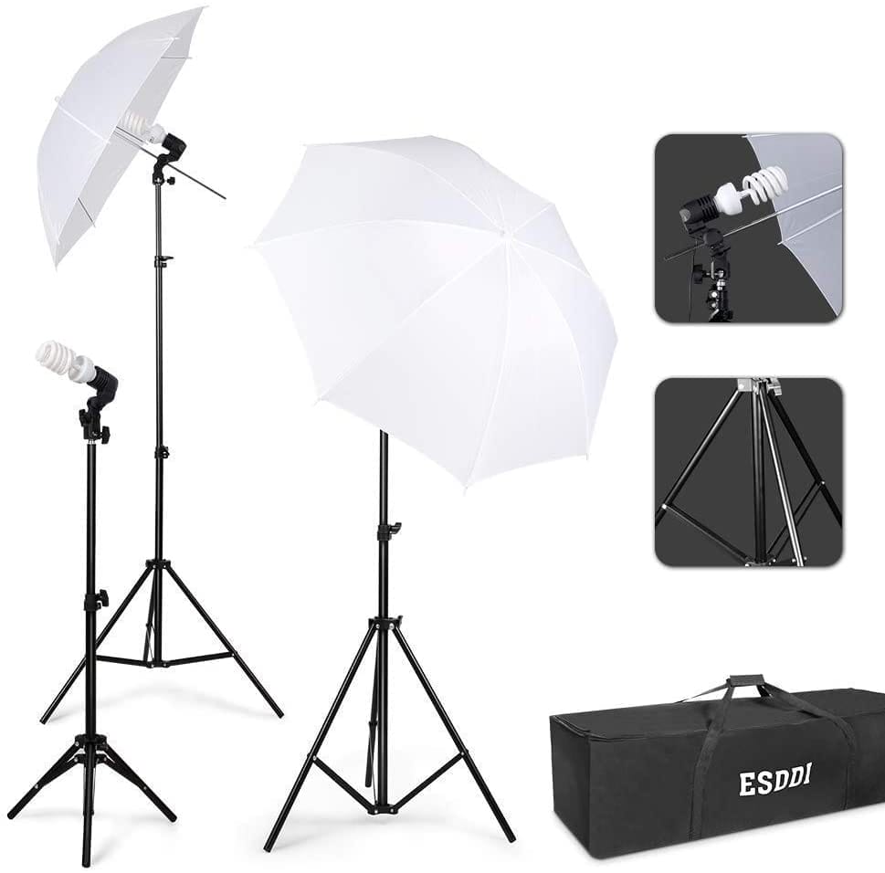 Image shows two photo umbrellas, tripods, and light bulbs.