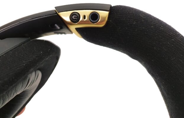 Image shows the power button and the AUX input jack port.