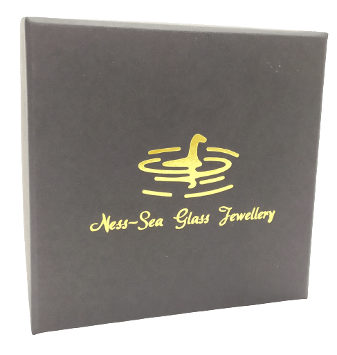 Image shows a black giftbox. The Ness-Sea Glass logo is in gold.