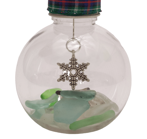 Image shows a close up view of the snowflake charm and the sea glass.