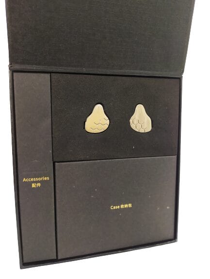 Image shows the black internal packaging. The image shows the earphones neatly positioned to the top area.