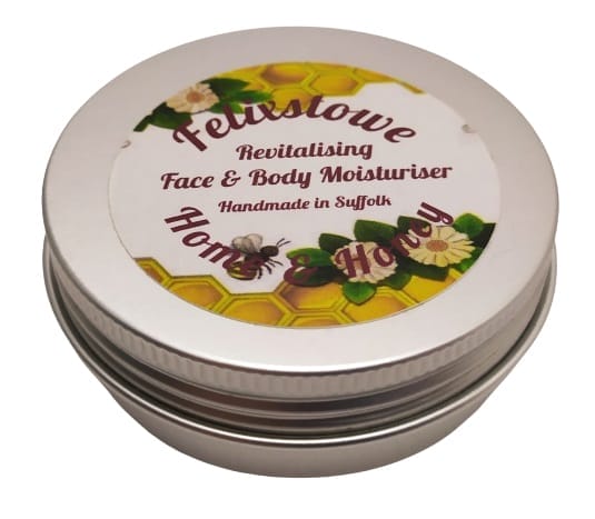 Image shows the tin, there is text which says... Felixstowe Home & Honey and revitalising face & body moisturiser. 