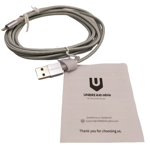 Image shows the included contents. There is a cable and the warranty card in the image.