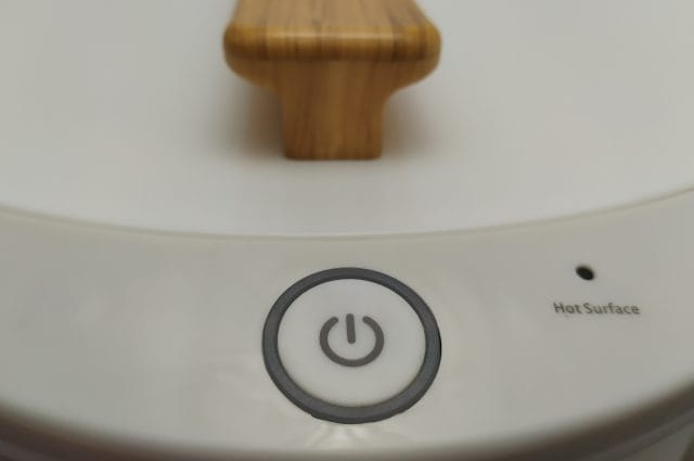 Image shows the on/off button for the Keenray Towel Warmer.