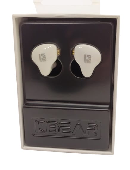 Image shows the KBEAR KS1 Earphones in their internal packaging, they're in a moulded plastic packet.