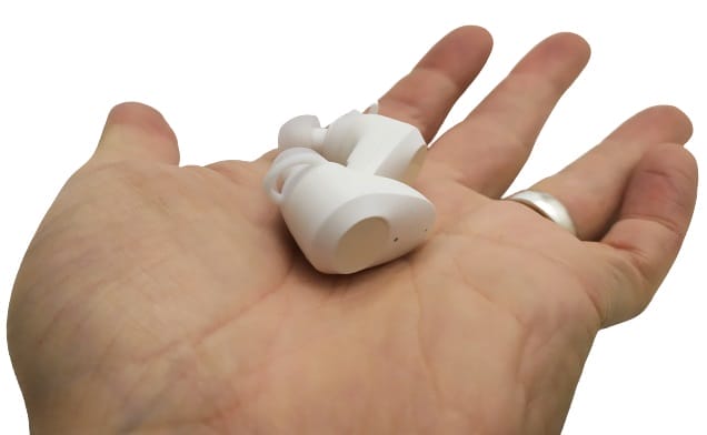 Image shows me holding the earbud on my left palm.