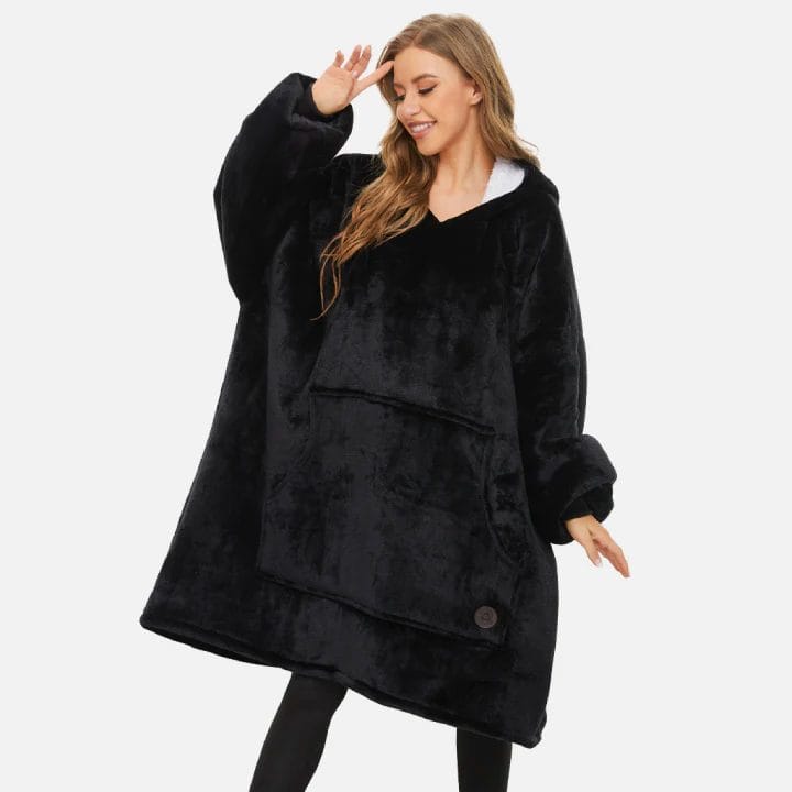 Image shows a women (model) wearing the blanket hoodie.