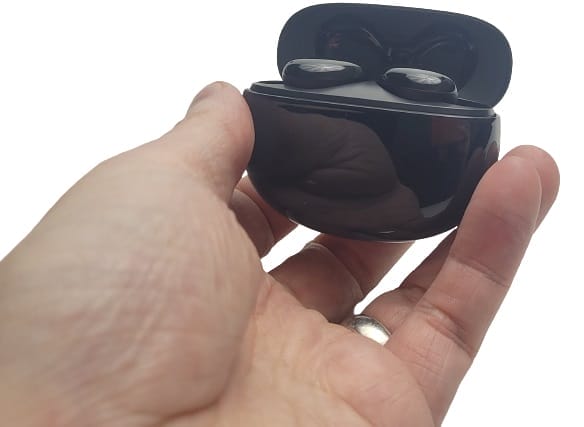 Image shows the D7 earbud case in my left hand.