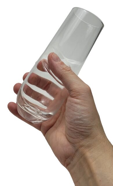 Image shows me holding a glass in my right hand.