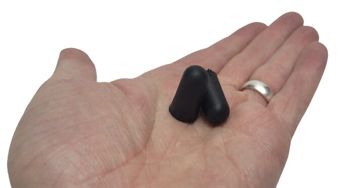 Image shows a pair of earplugs in my open left hand.