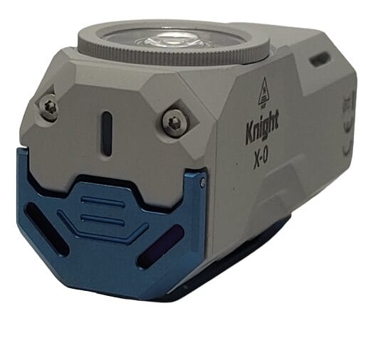 Image shows the torch laying down with the switch cover closed.