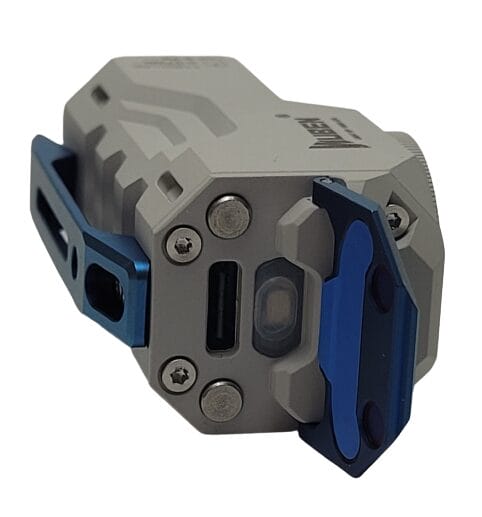 Image shows the torch laying down with the switch cover open.