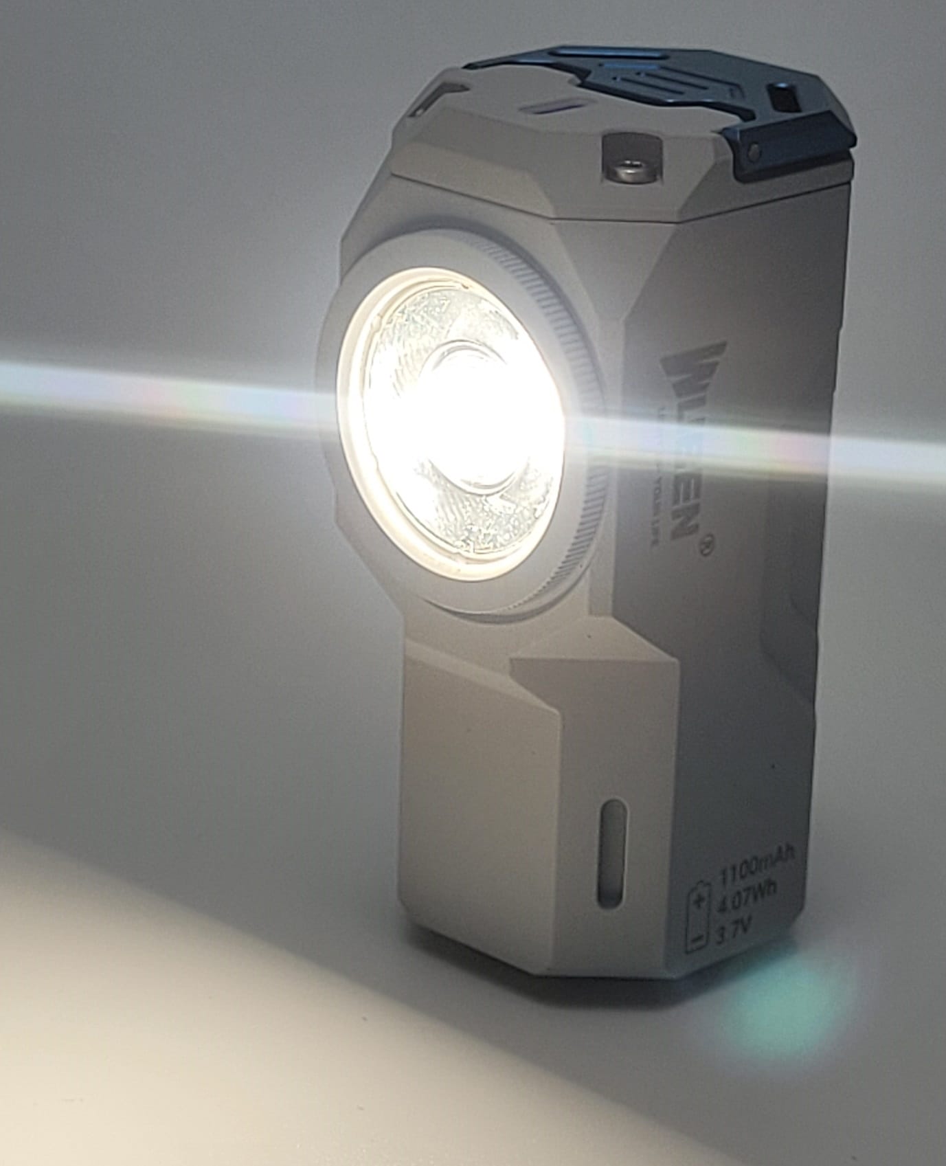 Wuben Knight X0 Torch Image shows the torch in an on position. The torch is resting upward.