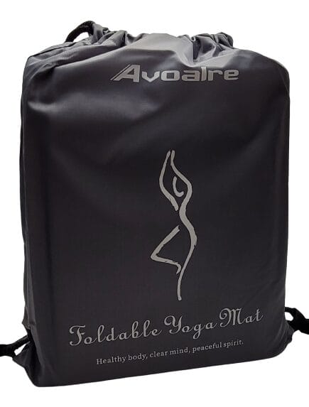 Image shows a grey drawstring bag, which includes the yoga mat.