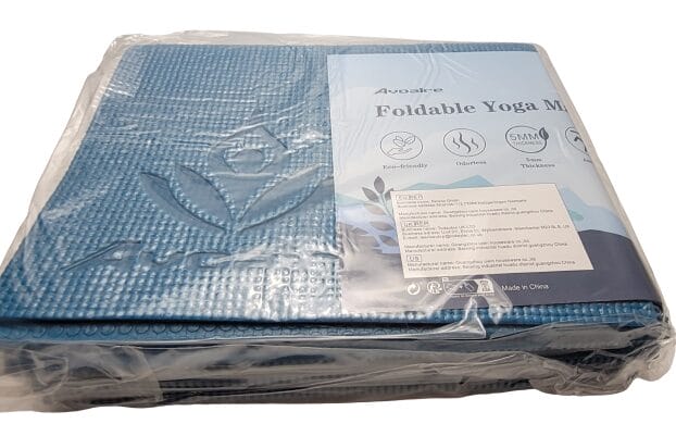 Image shows the yoga mat wrapped in plastic.