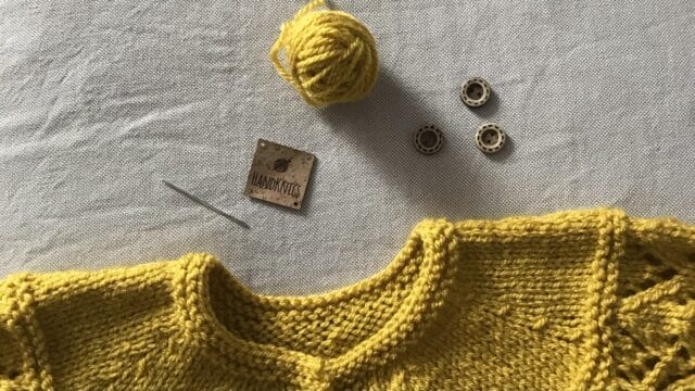 Label-and-neckline-of-cardigan-yellow