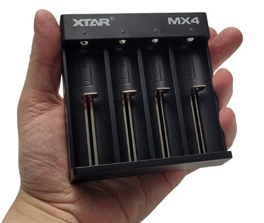 Image shows the XTAR MiniMixer MX4 Charger in my left hand.