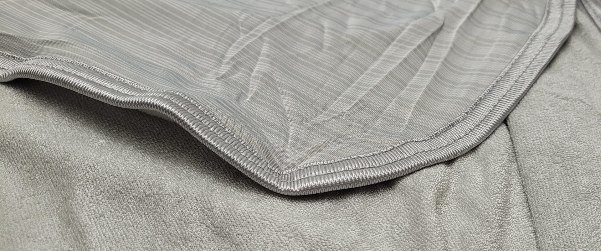 Avoalre Cooling Blanket Image shows both sides of the blanket.