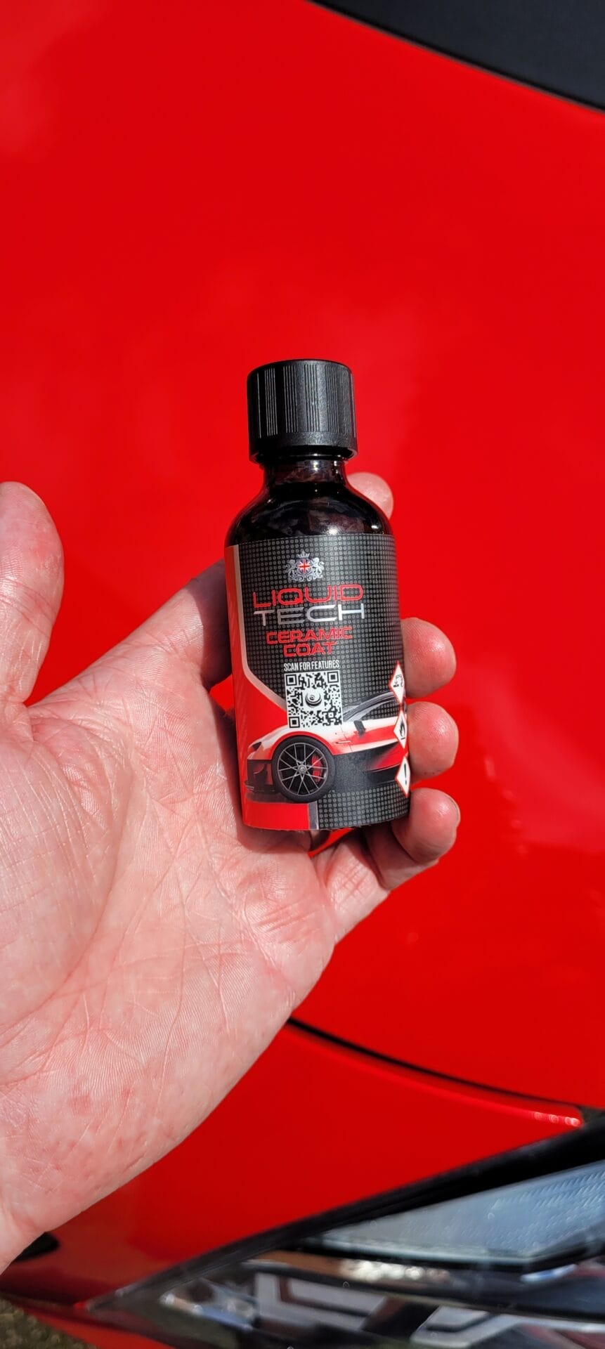 Image shows me holding the ceramic coating from Liquid Tech by Road Angel.