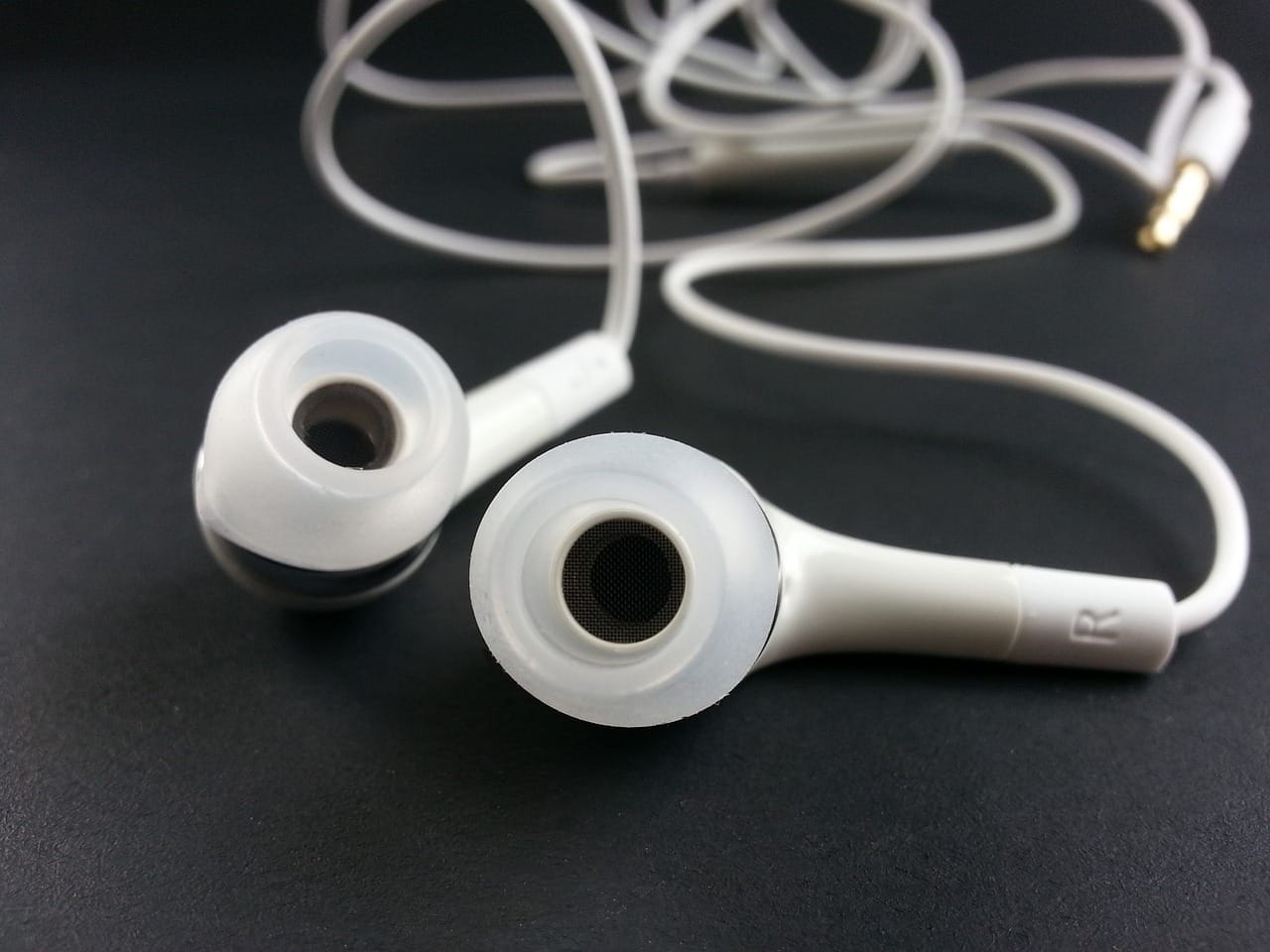 Image shows a generic pair of earphones, ideal illustration for the post From Electricity to Eardrums: The Magic of Earphones.