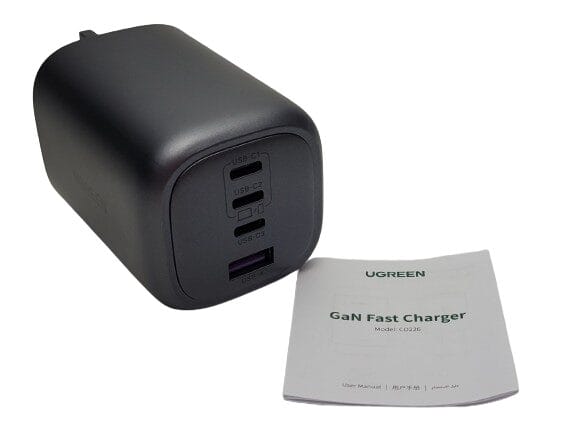 Image shows the included contents. Image shows a wall charger and paper manual laid out.