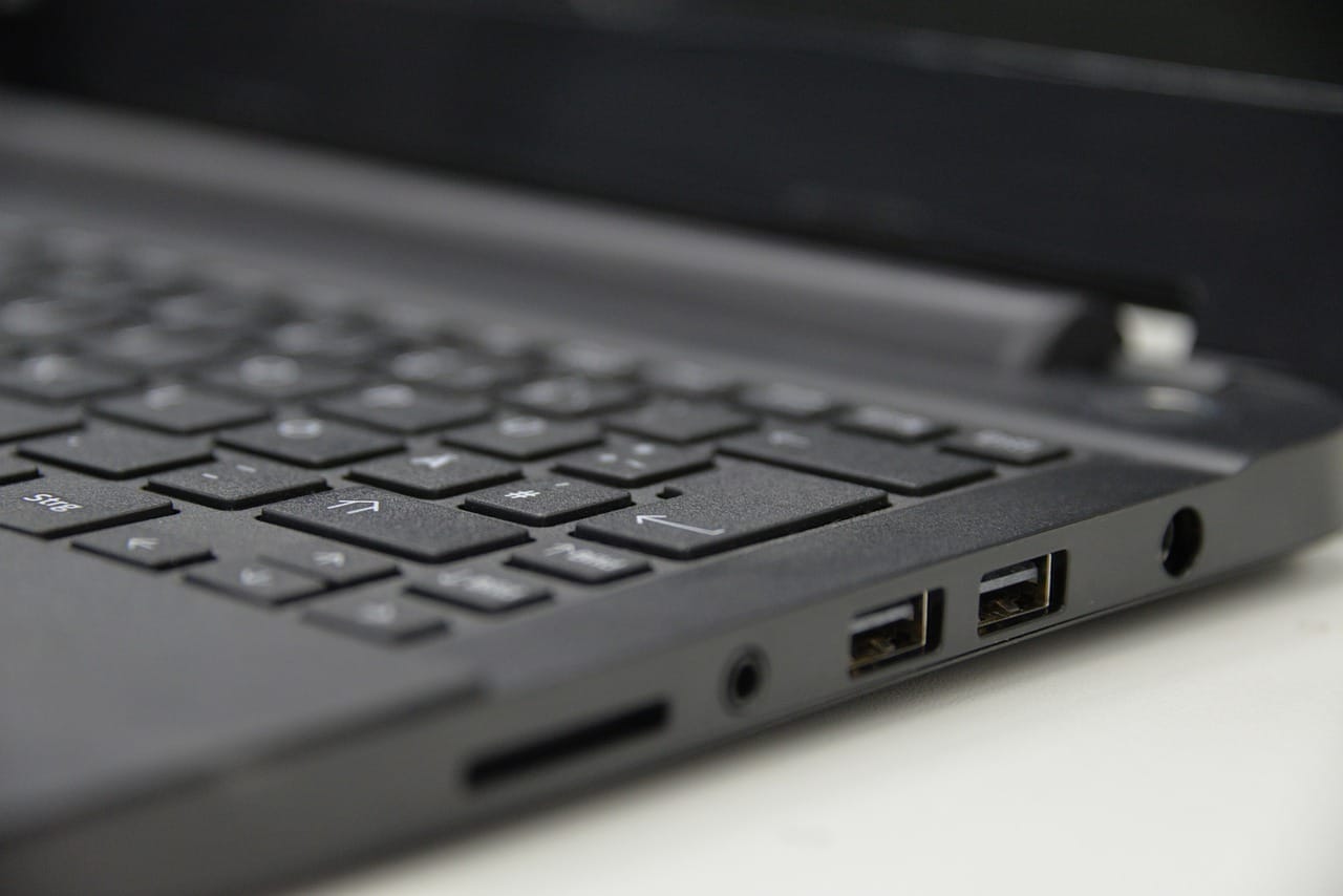 Image shows a laptop with USB ports.