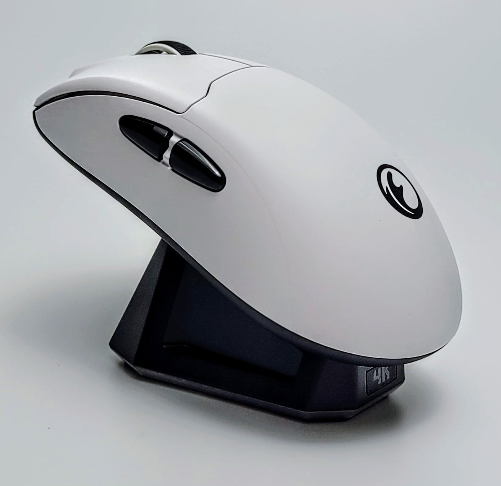 IFYOO G63 Gaming Mouse Image shows the mouse on the charging dock.