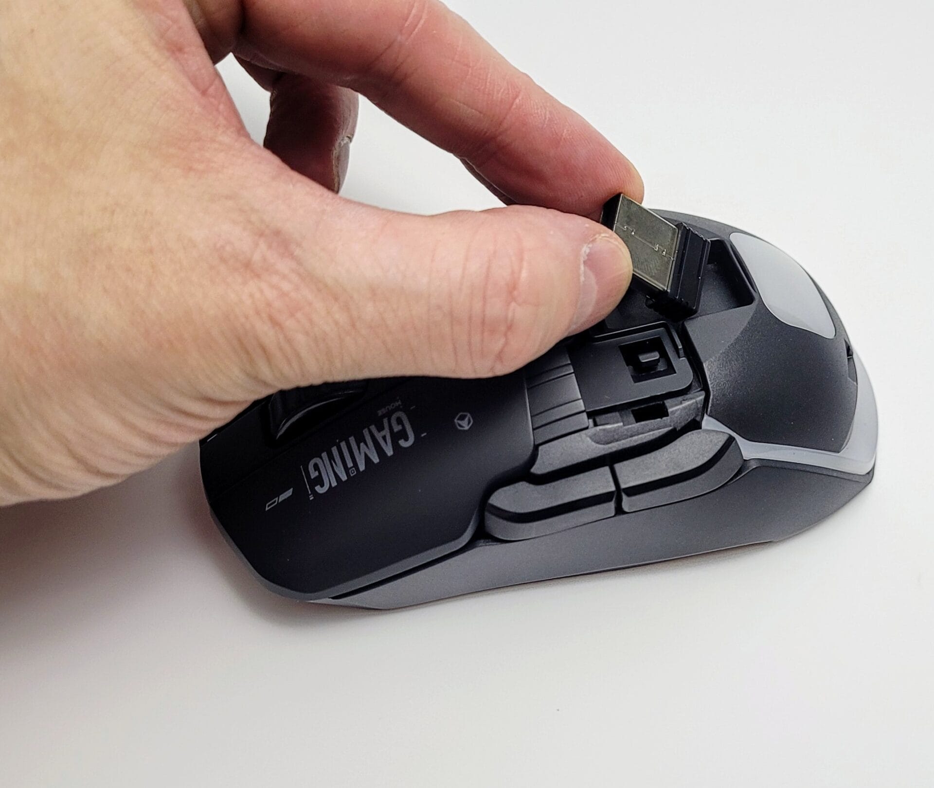 Image shows the USB receiver inside the mouse.