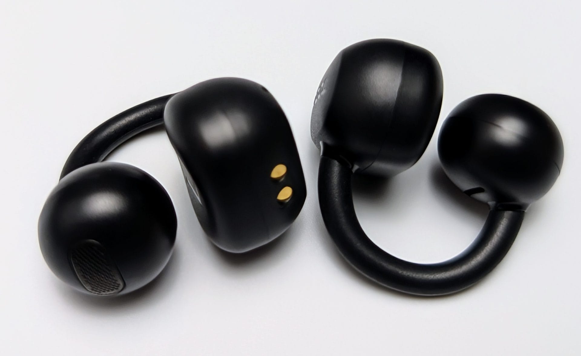 Image shows the earbuds in a laid out position.