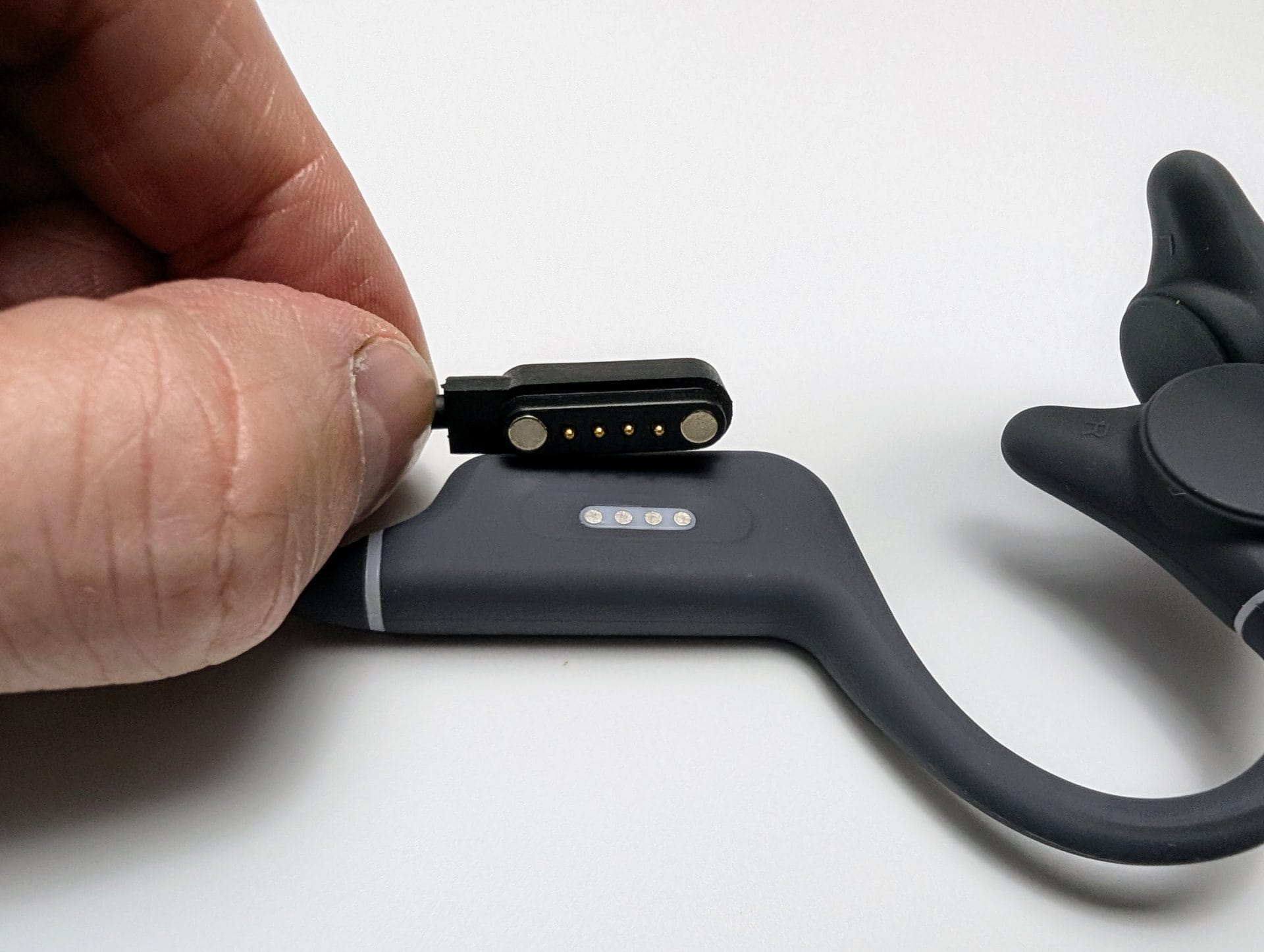 Image shows the headphones on charge.