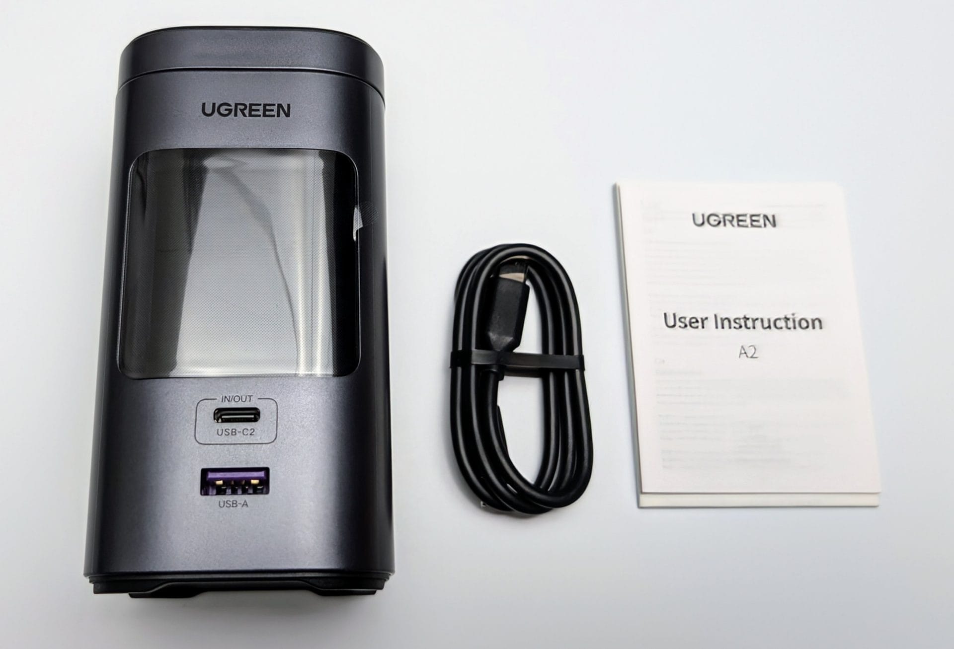 Image shows the included contents of the UGREEN 145W 20000mAh Magsafe Power Bank.