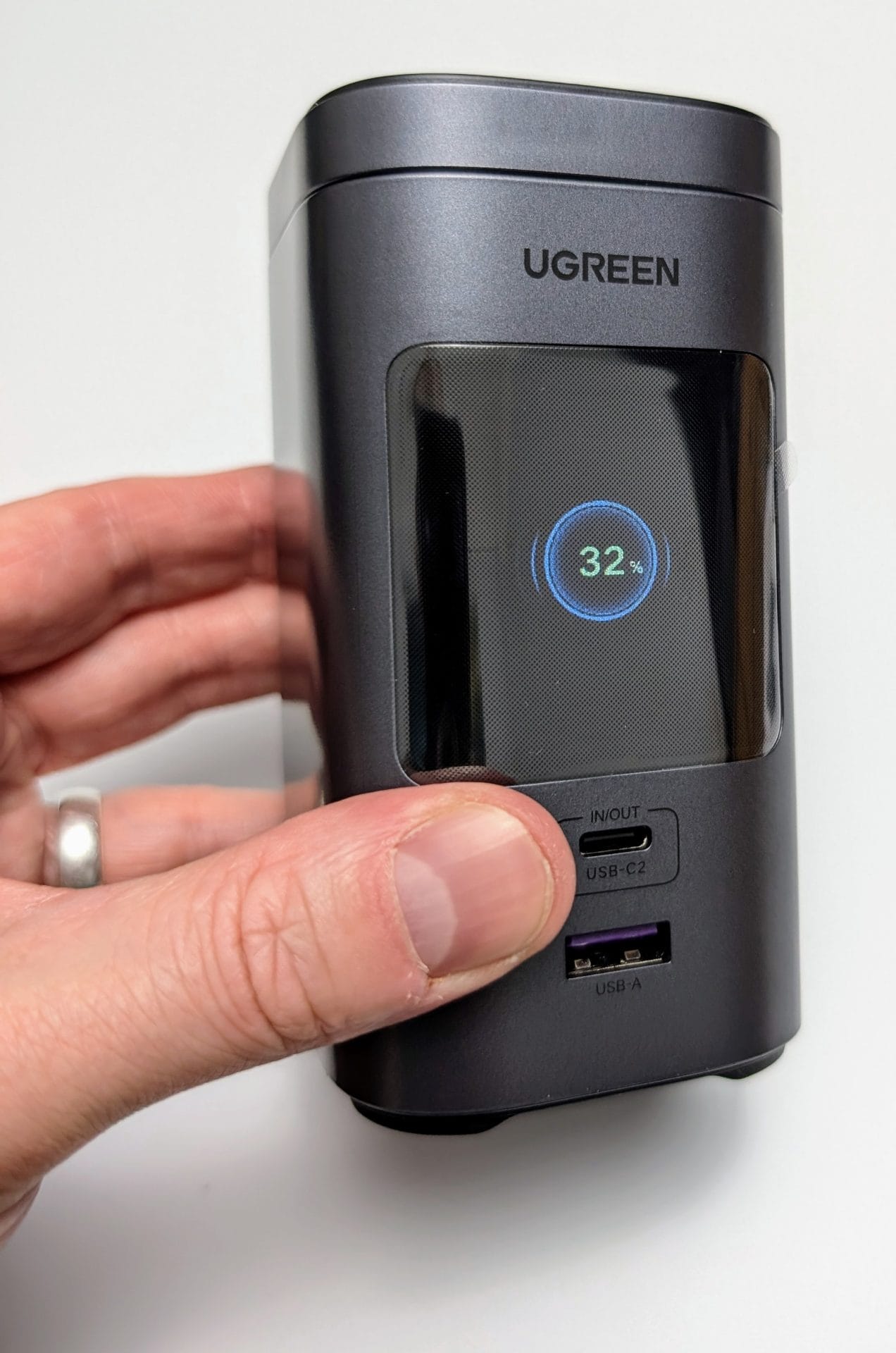 Image shows the UGREEN 145W 20000mAh Magsafe Power Bank in my left hand.