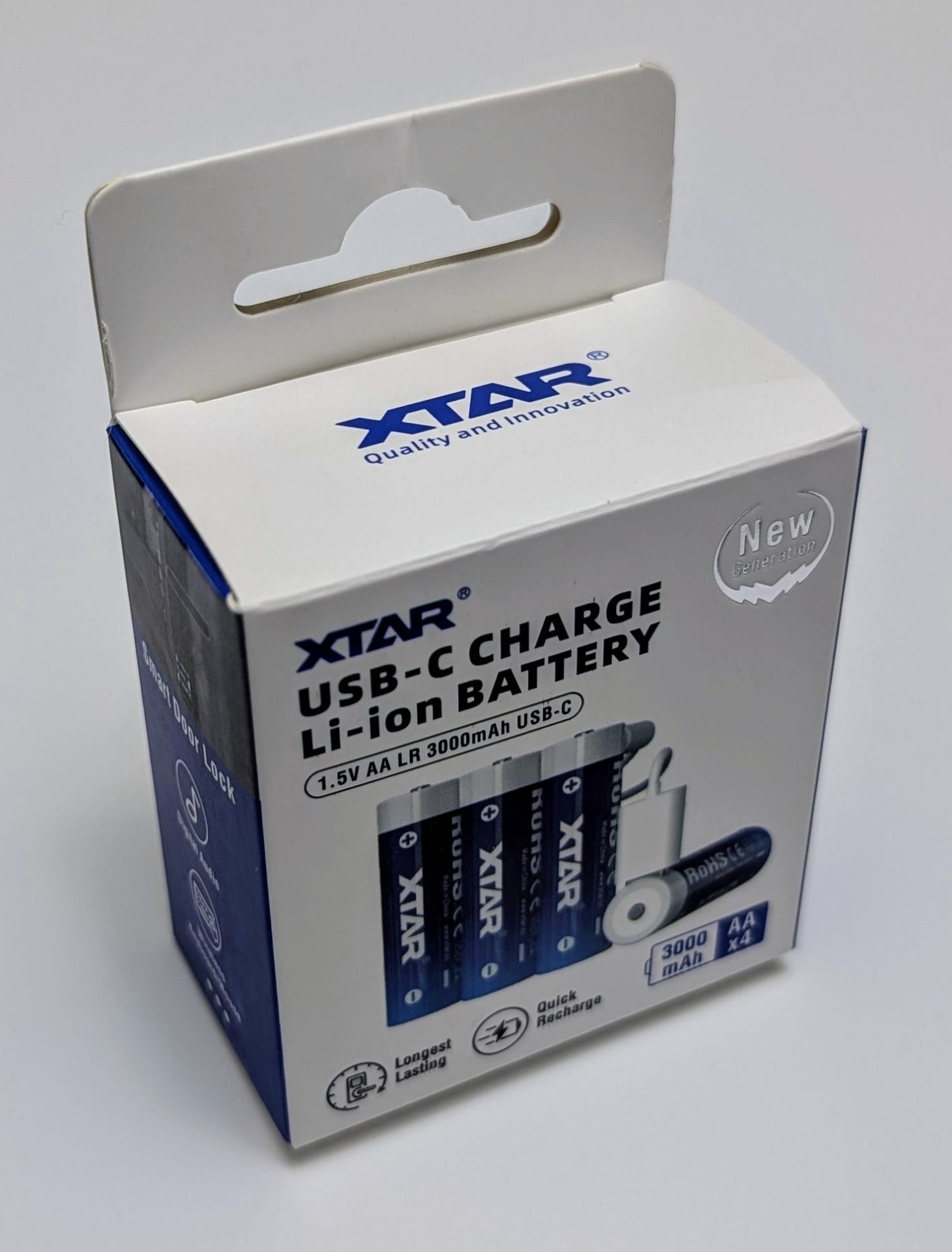 XTAR 1.5V AA LR 3000mAh USB-C Lithium Batteries Package of XTAR 1.5V AA LR 3000mAh USB-C Lithium Batteries, featuring a white and blue box with a hang tab. The front displays the XTAR logo, "USB-C Charge Li-ion Battery," and "1.5V AA LR 3000mAh USB-C" text. The box includes images of four AA batteries, a USB-C cable, and highlights such as "New Generation," "Quick Recharge," and "Longest Lasting."