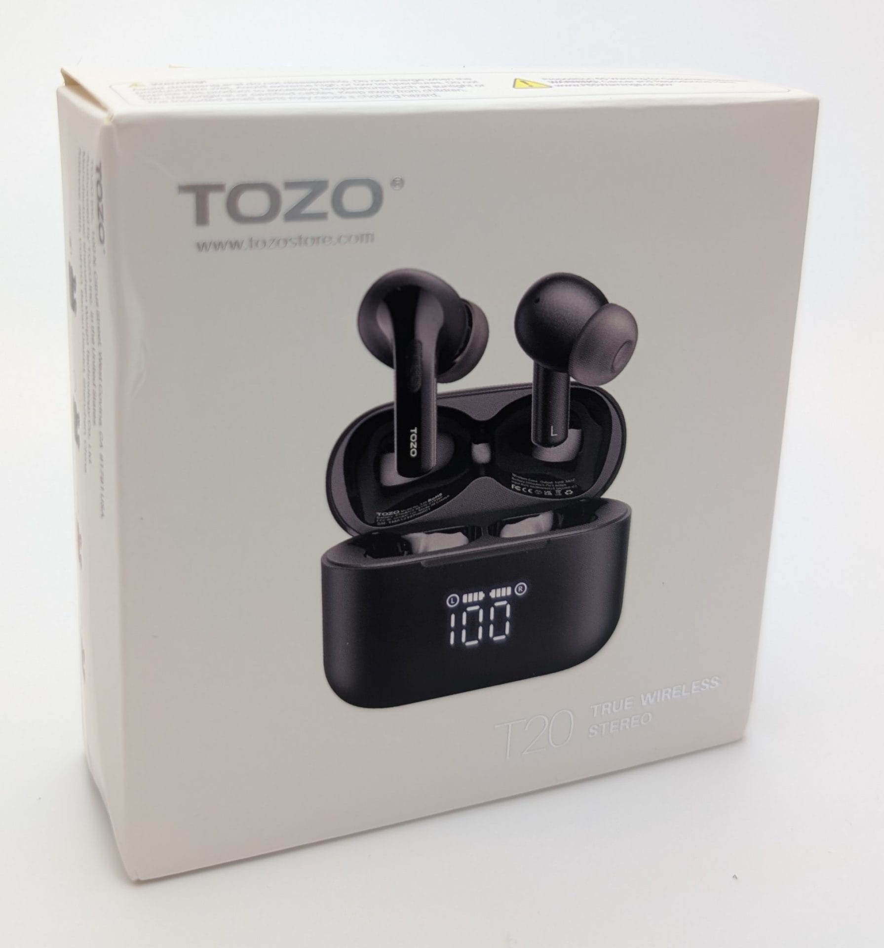 Image of TOZO T20 True Wireless Stereo Earbuds packaging, featuring a black charging case with a digital display showing "100" and two earbuds placed inside. The box has the TOZO logo and website (www.tozostore.com) (www.tozostore.com) printed on the side, with a sleek, modern design.